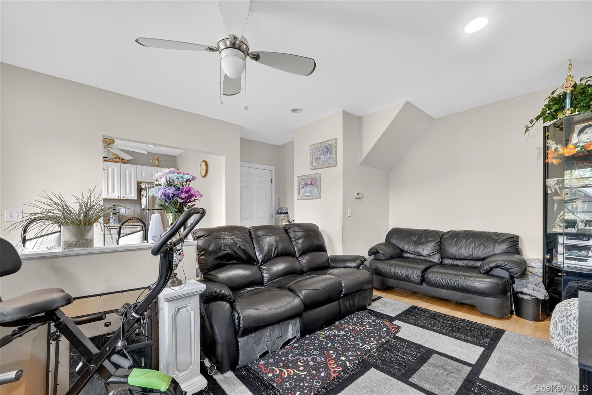 16 Maple Place Ossining, NY 10562 - Photo 18 of 45 a living room with furniture a couch and a flat screen tv