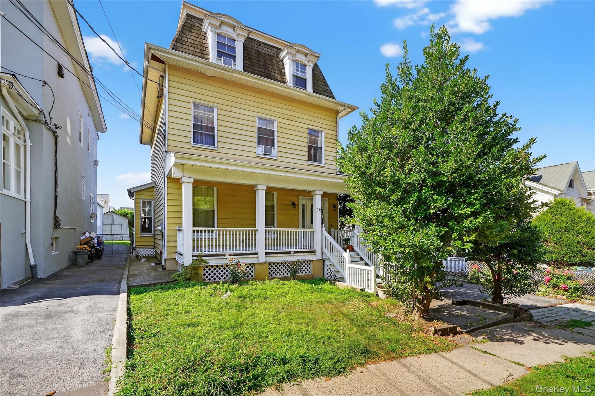16 Maple Place Ossining, NY 10562 - Photo 2 of 45 a front view of a house with a yard