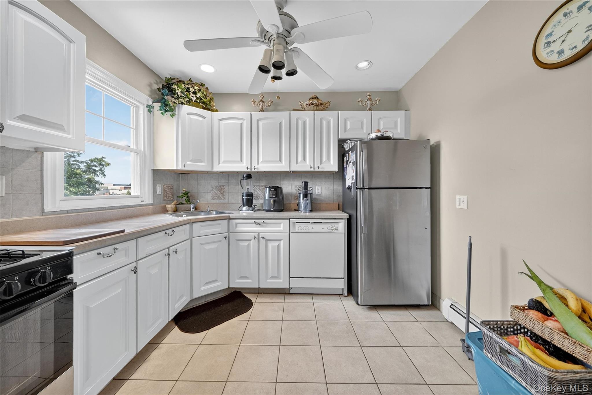 16 Maple Place Ossining, NY 10562 - Photo 22 of 45 a kitchen with a white refrigerator stove top oven and sink
