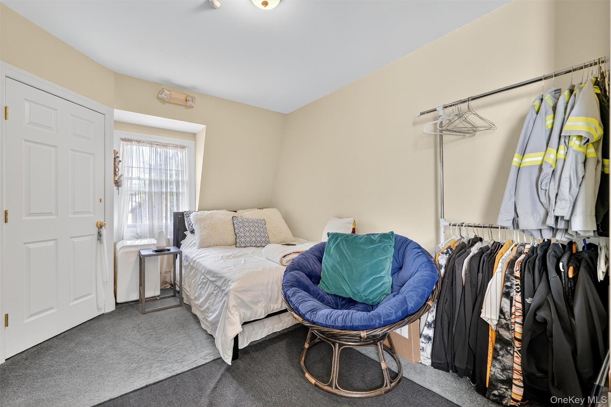 16 Maple Place Ossining, NY 10562 - Photo 27 of 45 a bed room with furniture and a chair