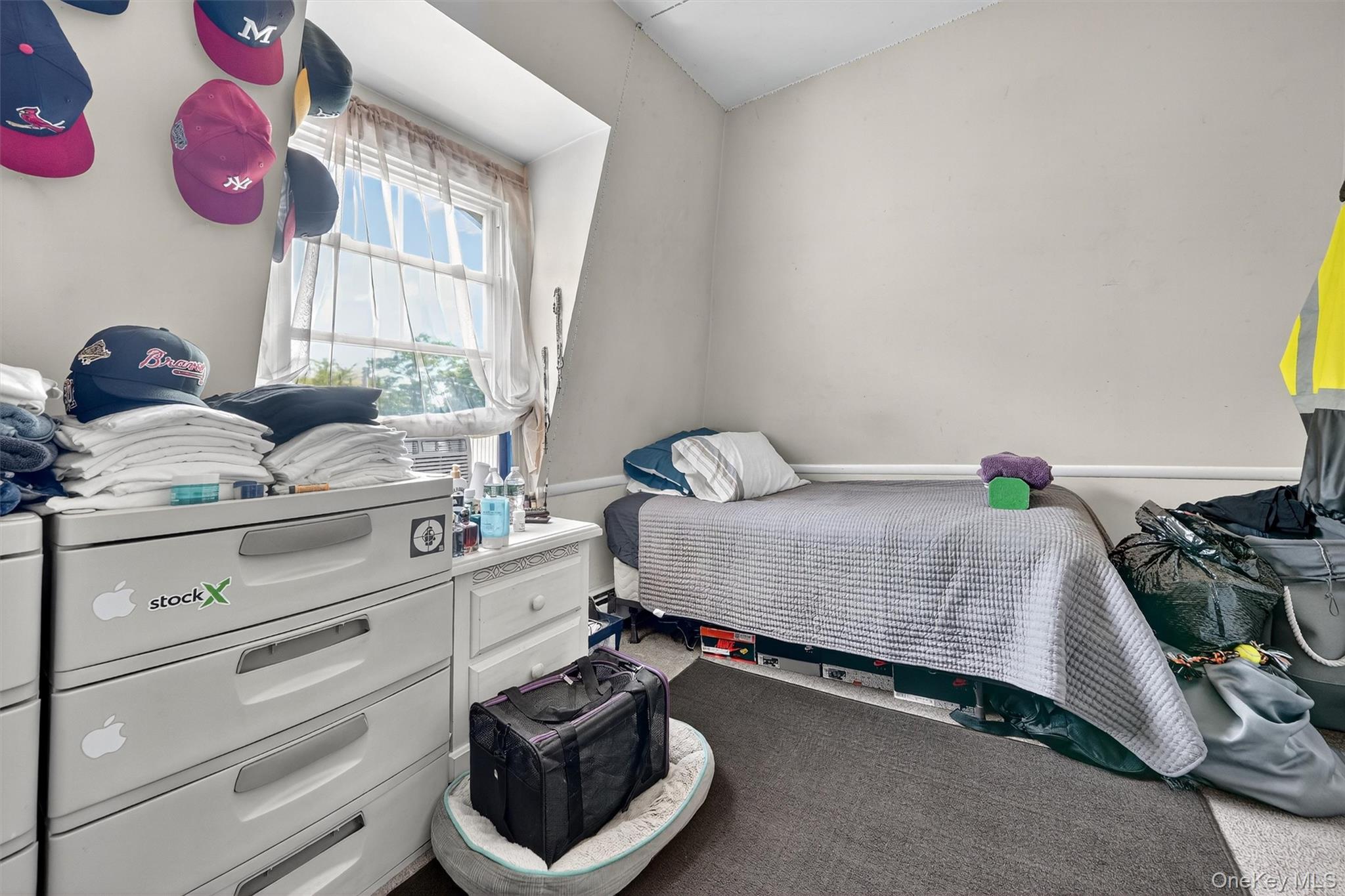 16 Maple Place Ossining, NY 10562 - Photo 29 of 45 a bedroom with a bed and a window