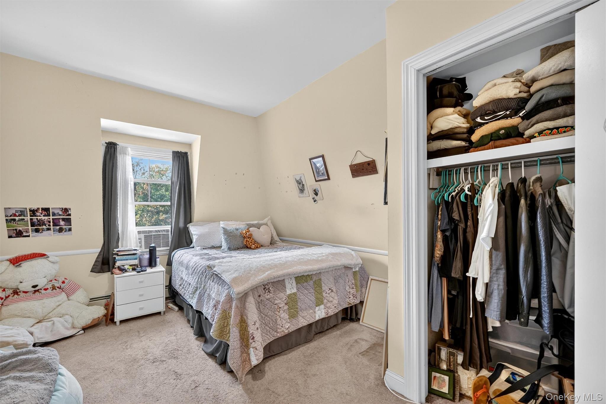 16 Maple Place Ossining, NY 10562 - Photo 31 of 45 a bedroom with a bed and a window