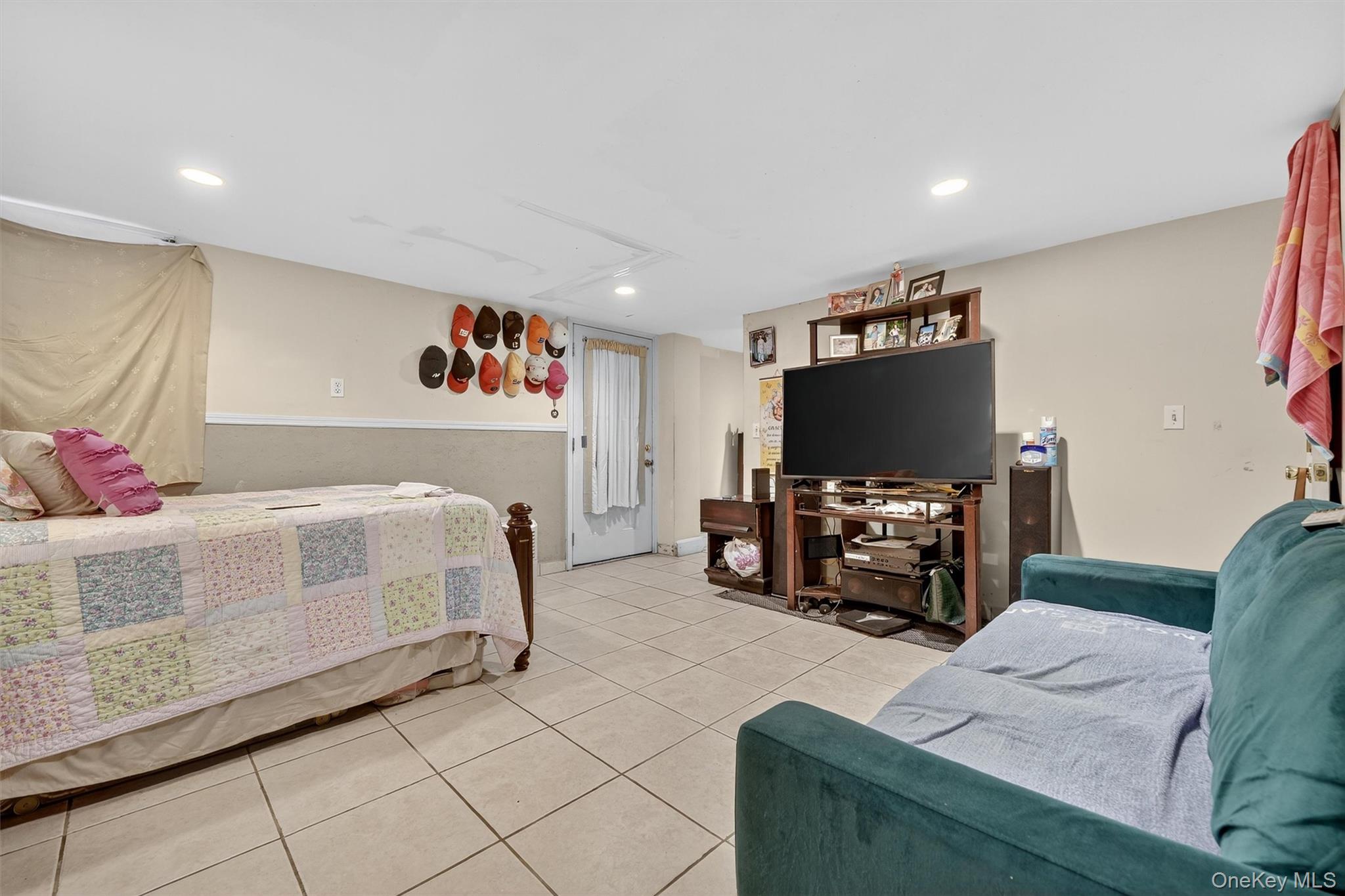 16 Maple Place Ossining, NY 10562 - Photo 36 of 45 a bedroom with furniture and a flat screen tv