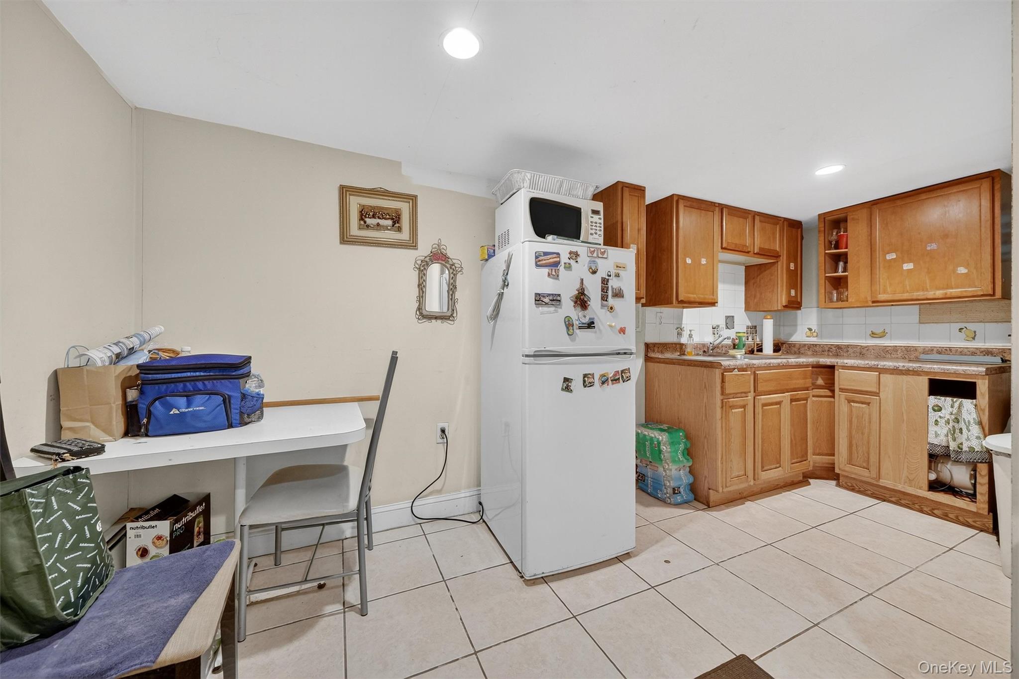16 Maple Place Ossining, NY 10562 - Photo 37 of 45 a kitchen with a cabinets and a refrigerator