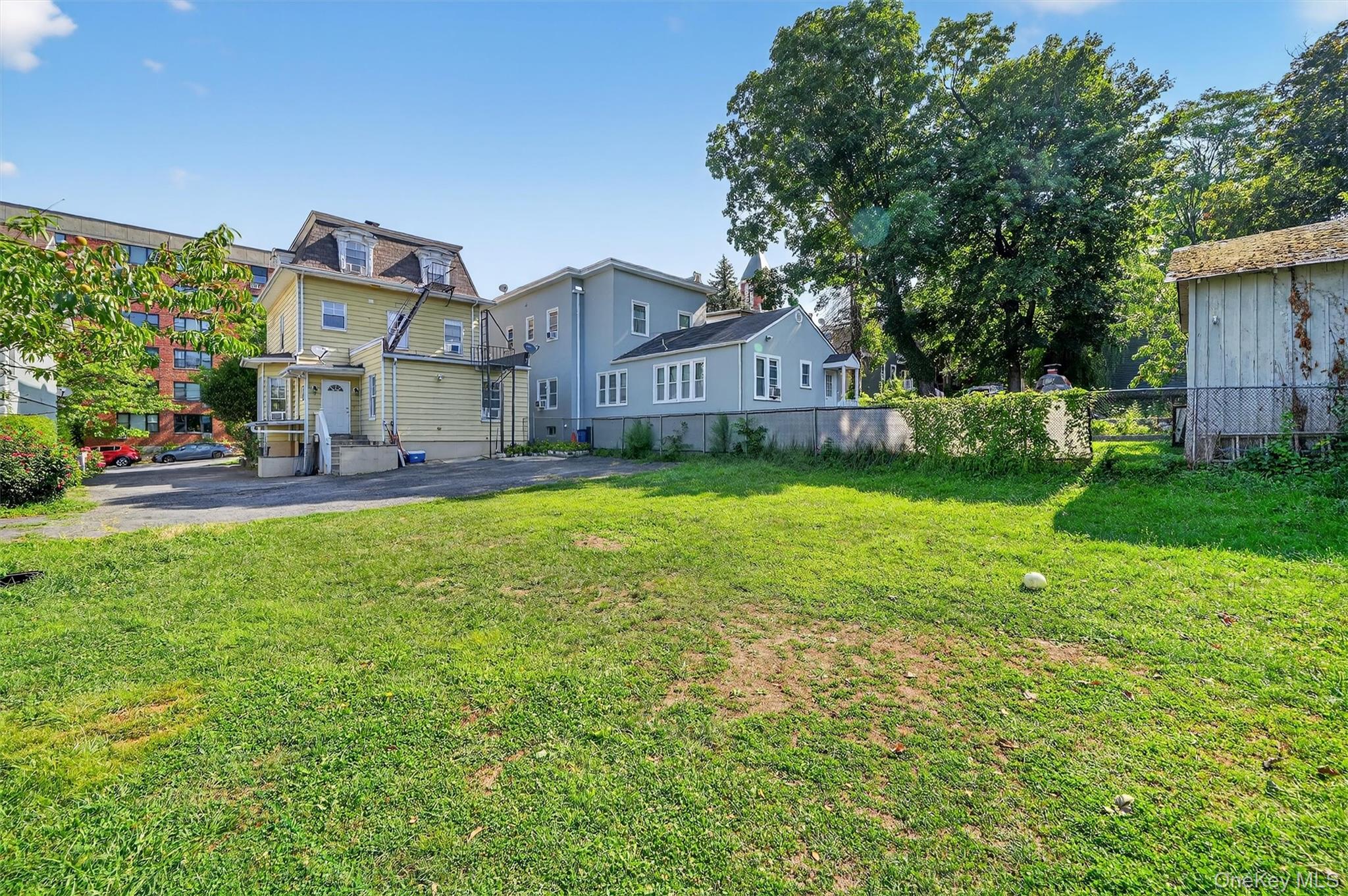 16 Maple Place Ossining, NY 10562 - Photo 42 of 45 a front view of a house with a yard and garage