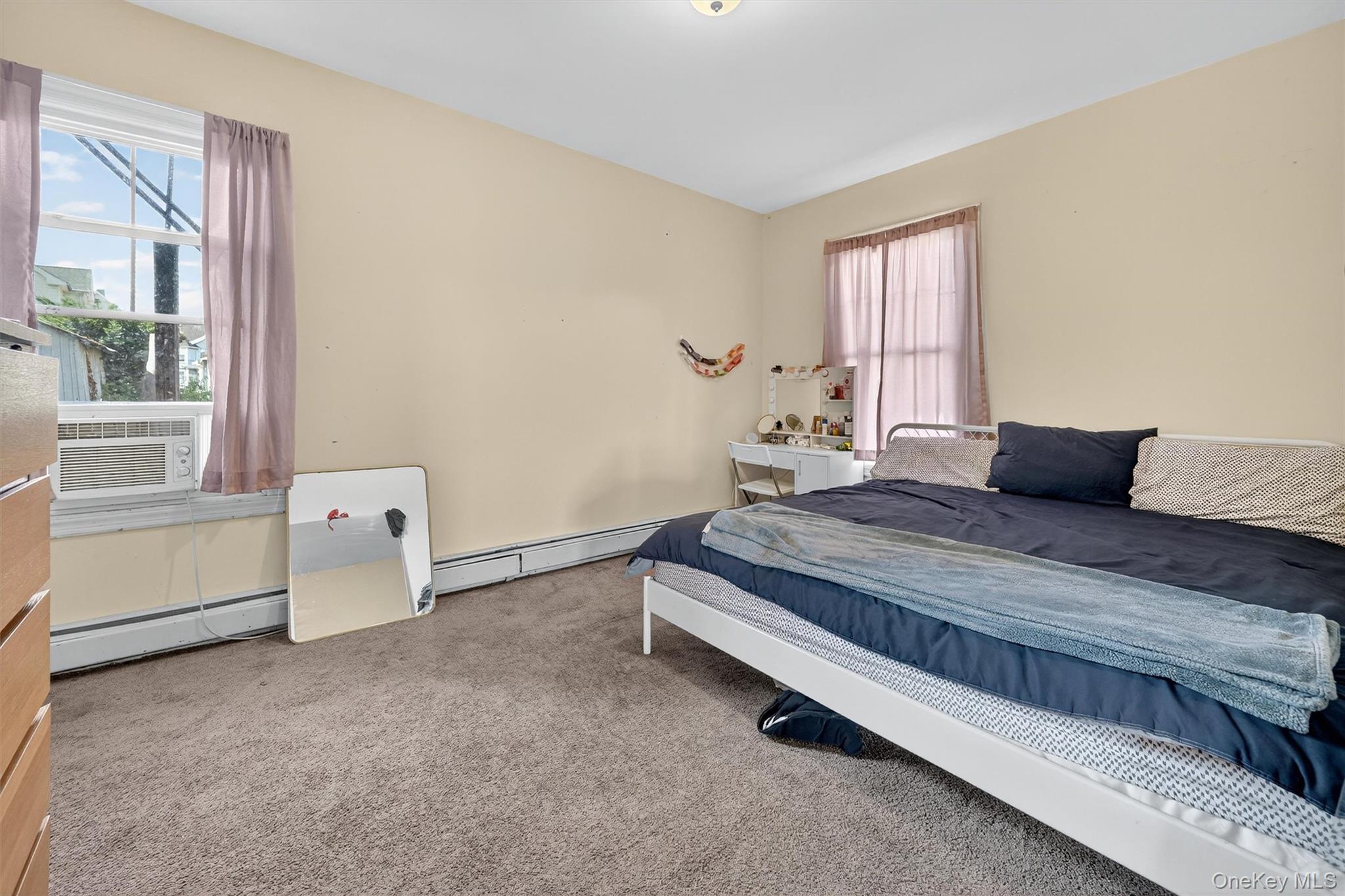 16 Maple Place Ossining, NY 10562 - Photo 7 of 45 a bedroom with a bed and a window