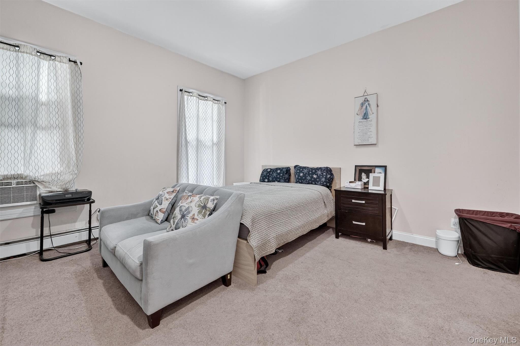 16 Maple Place Ossining, NY 10562 - Photo 8 of 45 a bedroom with a bed and a couch