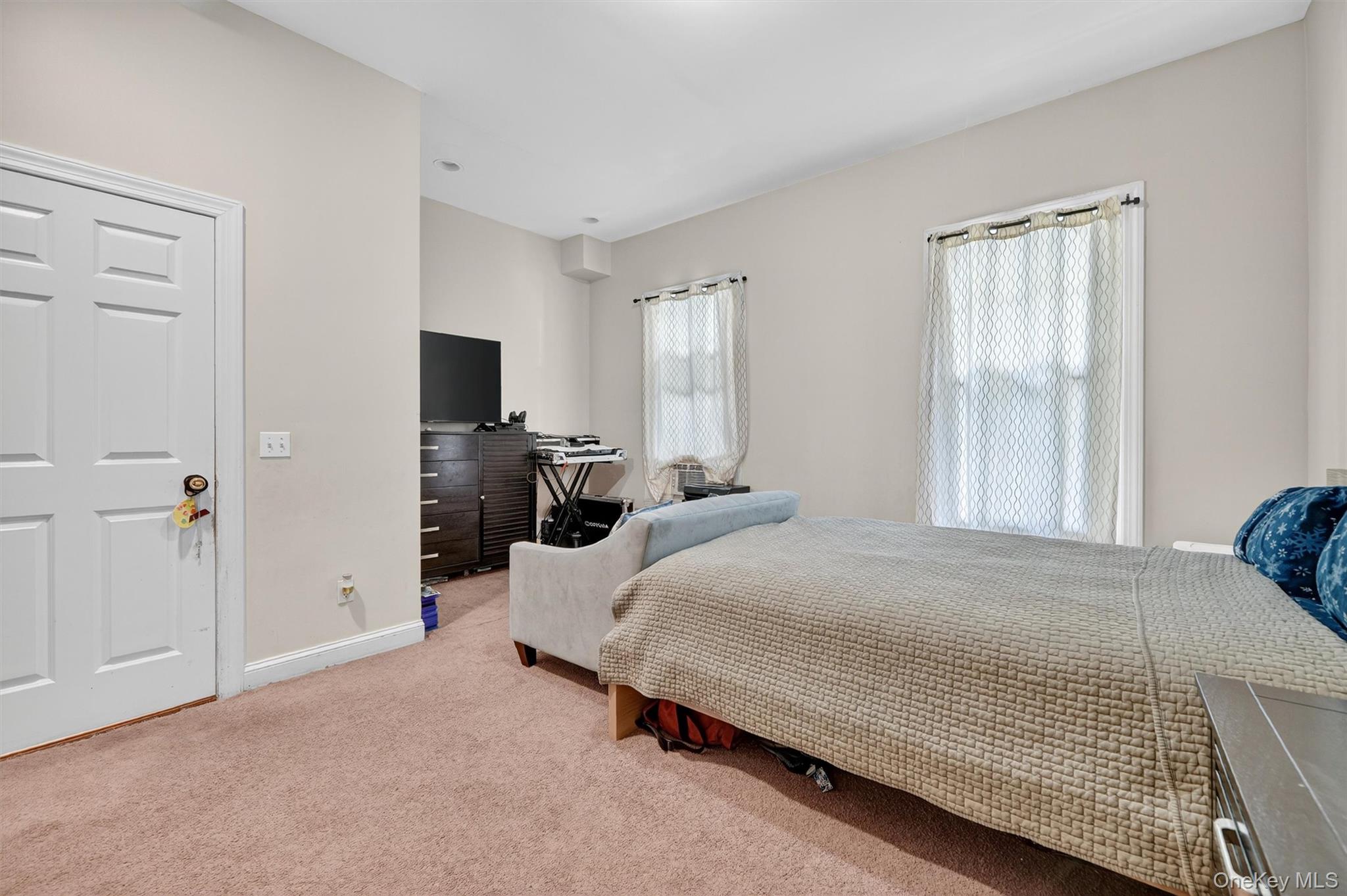 16 Maple Place Ossining, NY 10562 - Photo 9 of 45 a bedroom with a bed and wooden floor