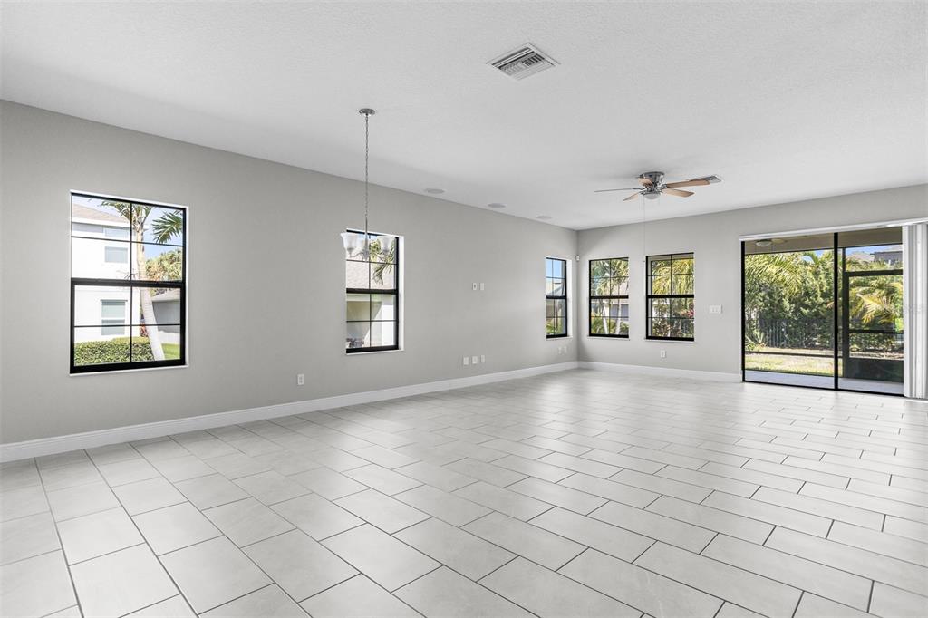 6906 Paradiso Drive Apollo Beach, FL 33572 - Photo 11 of 37 a view of an empty room with windows