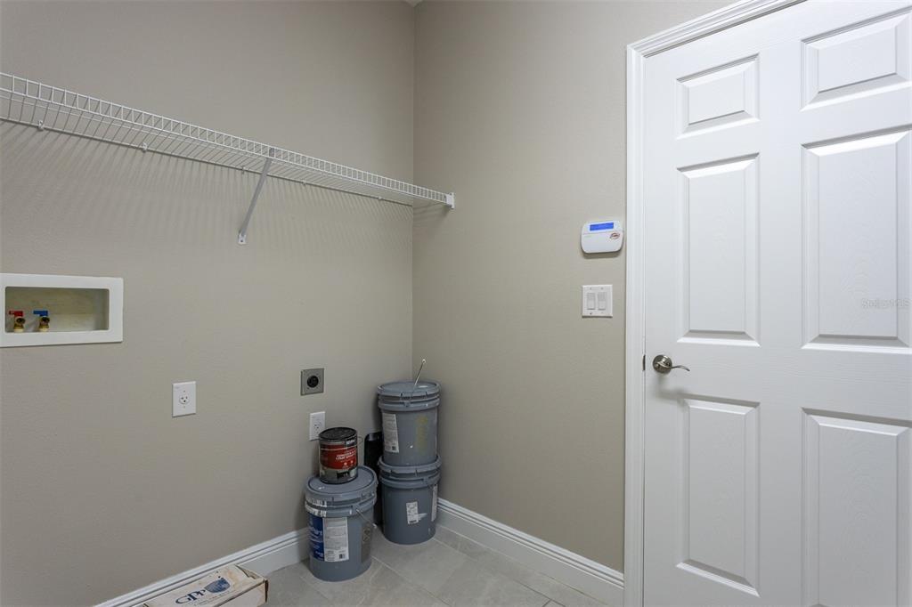6906 Paradiso Drive Apollo Beach, FL 33572 - Photo 27 of 37 a view of storage and utility room with empty racks