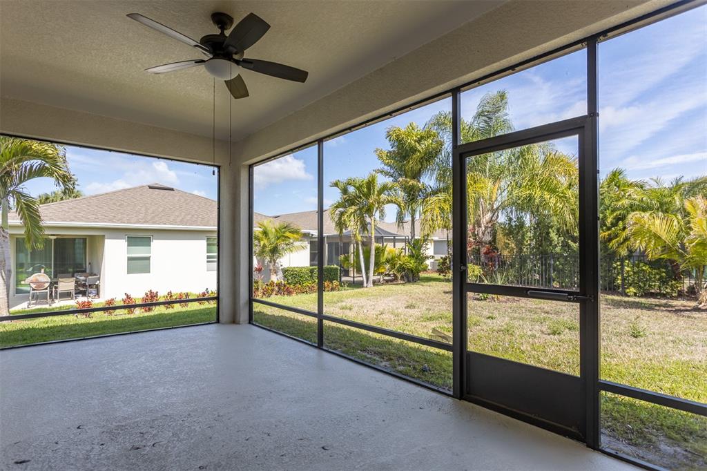6906 Paradiso Drive Apollo Beach, FL 33572 - Photo 28 of 37 a view of an empty room with a floor to ceiling window and stairs