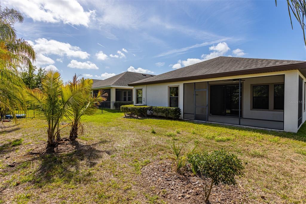 6906 Paradiso Drive Apollo Beach, FL 33572 - Photo 32 of 37 a view of a house with a yard