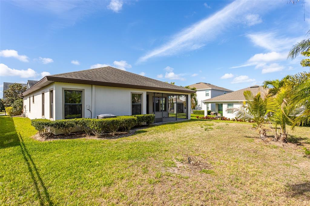 6906 Paradiso Drive Apollo Beach, FL 33572 - Photo 33 of 37 a front view of house with yard and green space