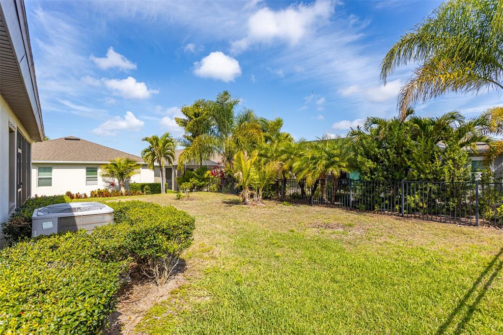 6906 Paradiso Drive Apollo Beach, FL 33572 - Photo 34 of 37 a swimming pool with outdoor seating and yard