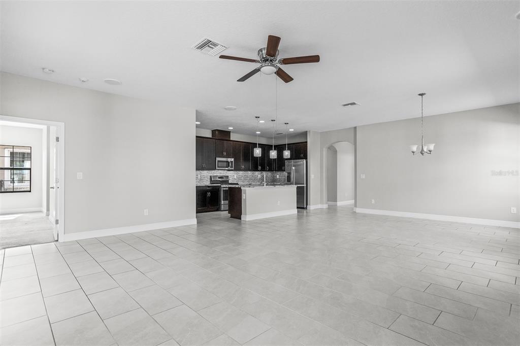 6906 Paradiso Drive Apollo Beach, FL 33572 - Photo 9 of 37 a view of a kitchen with a sink and a stove top oven