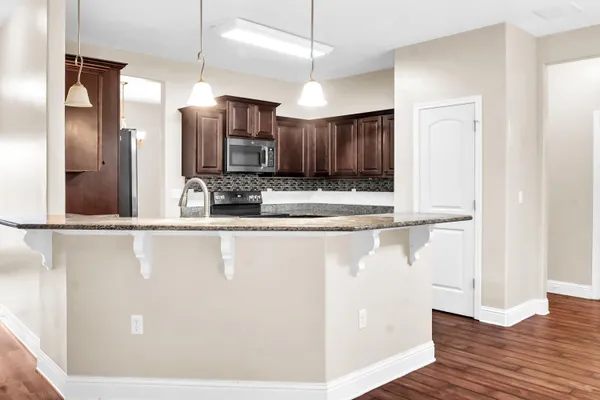 a bathroom with a sink toilet vanity and shower