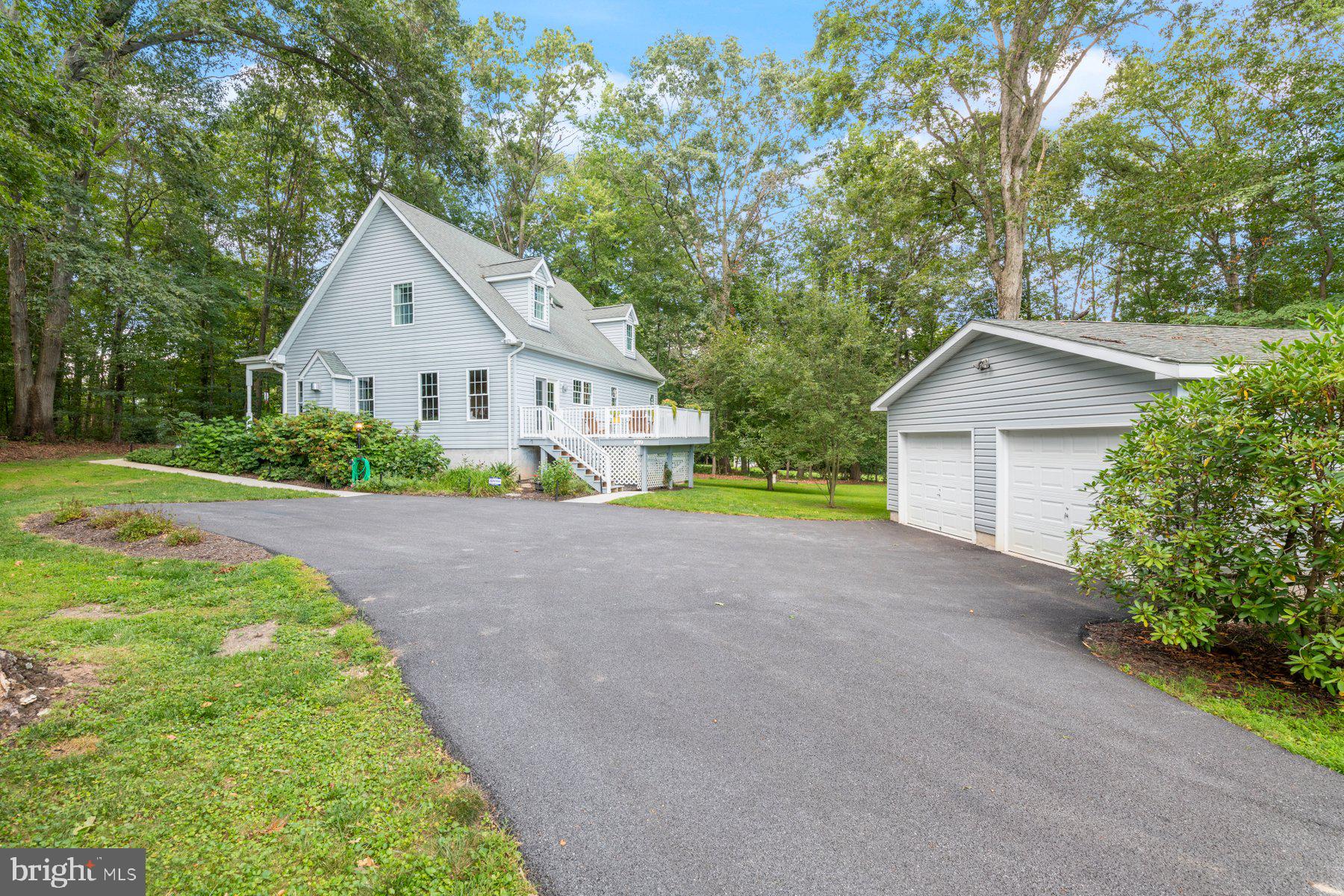 1012 Bernoudy Road White Hall, MD 21161 - Photo 22 of 28 a view of yellow house with a yard and large trees