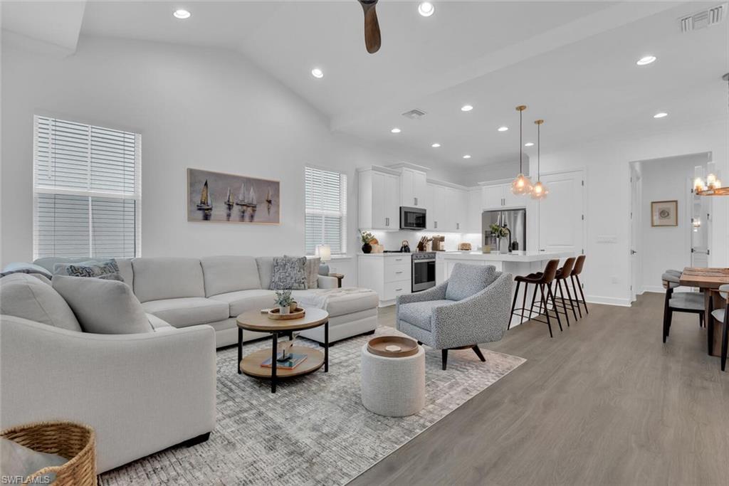 7242 Saona Court Naples, FL 34113 - Photo 1 of 34 a living room with furniture and a table