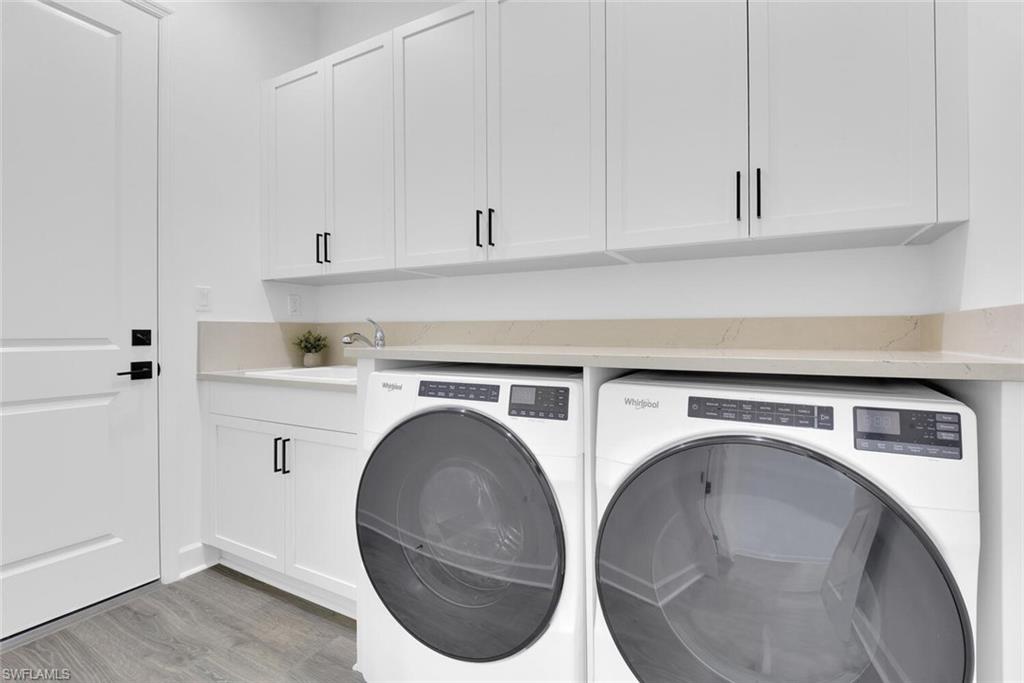 7242 Saona Court Naples, FL 34113 - Photo 16 of 34 a utility room with dryer and washer