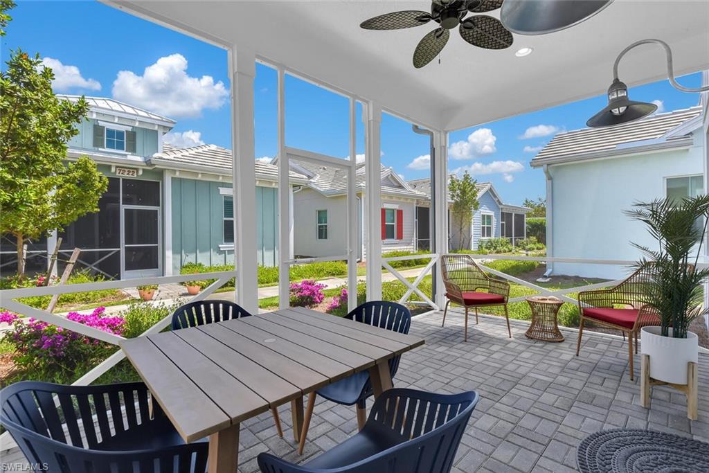 7242 Saona Court Naples, FL 34113 - Photo 17 of 34 a view of an outdoor dining space with a table and chairs