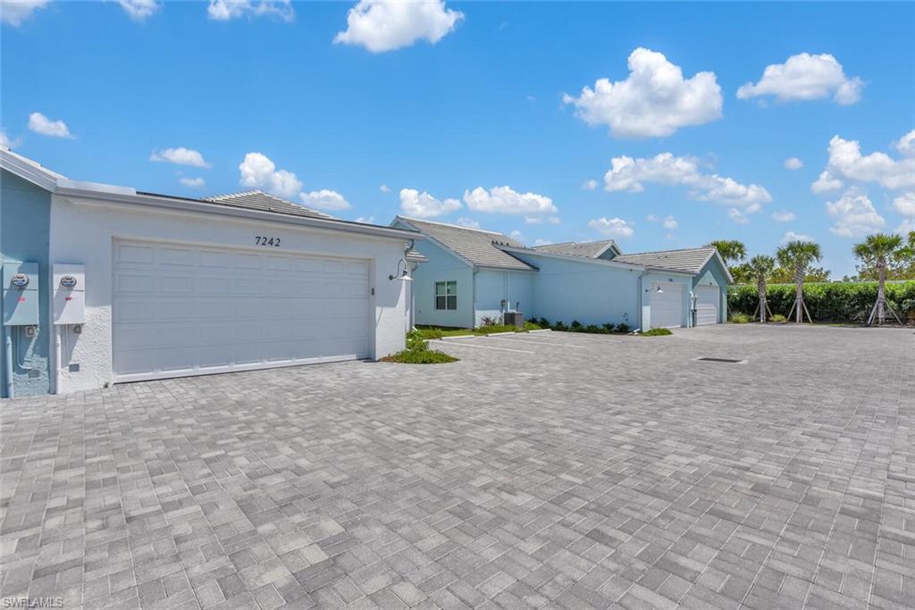 7242 Saona Court Naples, FL 34113 - Photo 19 of 34 a view of backyard of a house