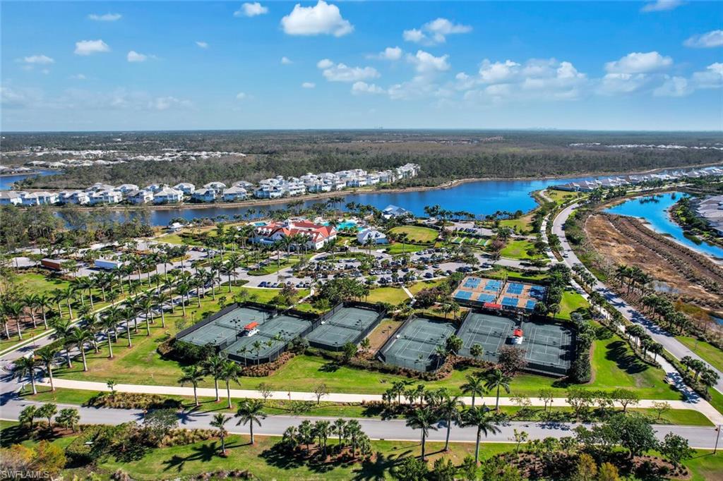 7242 Saona Court Naples, FL 34113 - Photo 22 of 34 an aerial view of residential houses with outdoor space