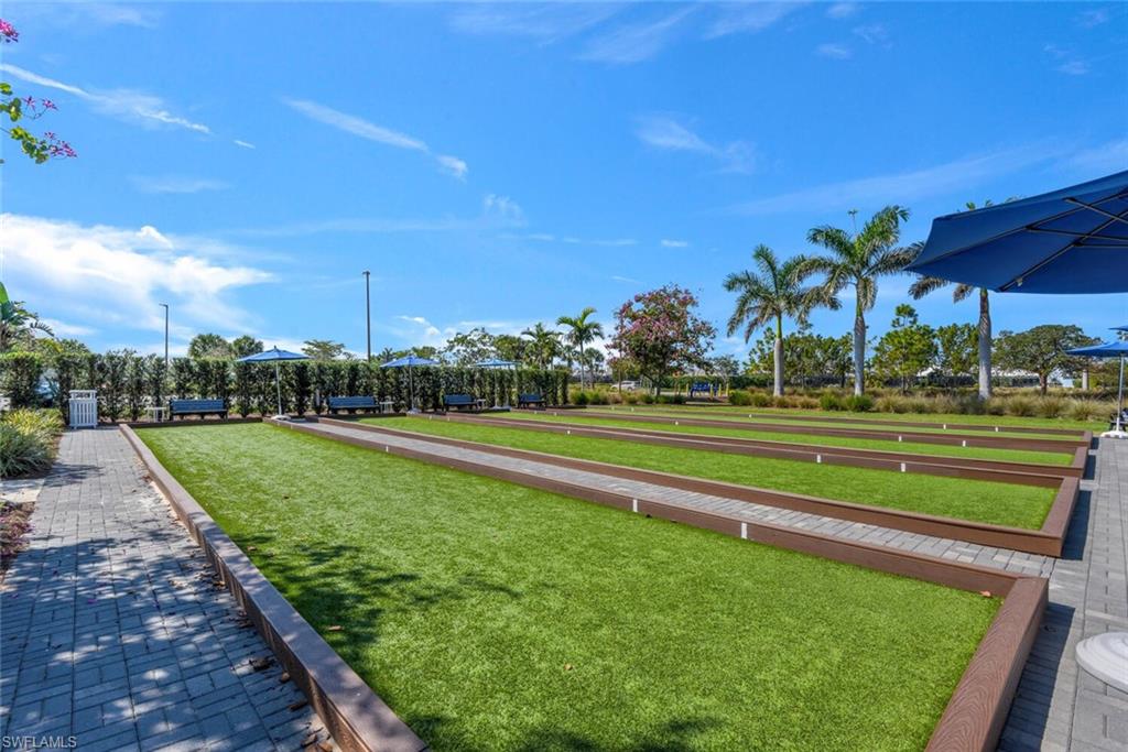 7242 Saona Court Naples, FL 34113 - Photo 32 of 34 a view of a golf course with a lake view