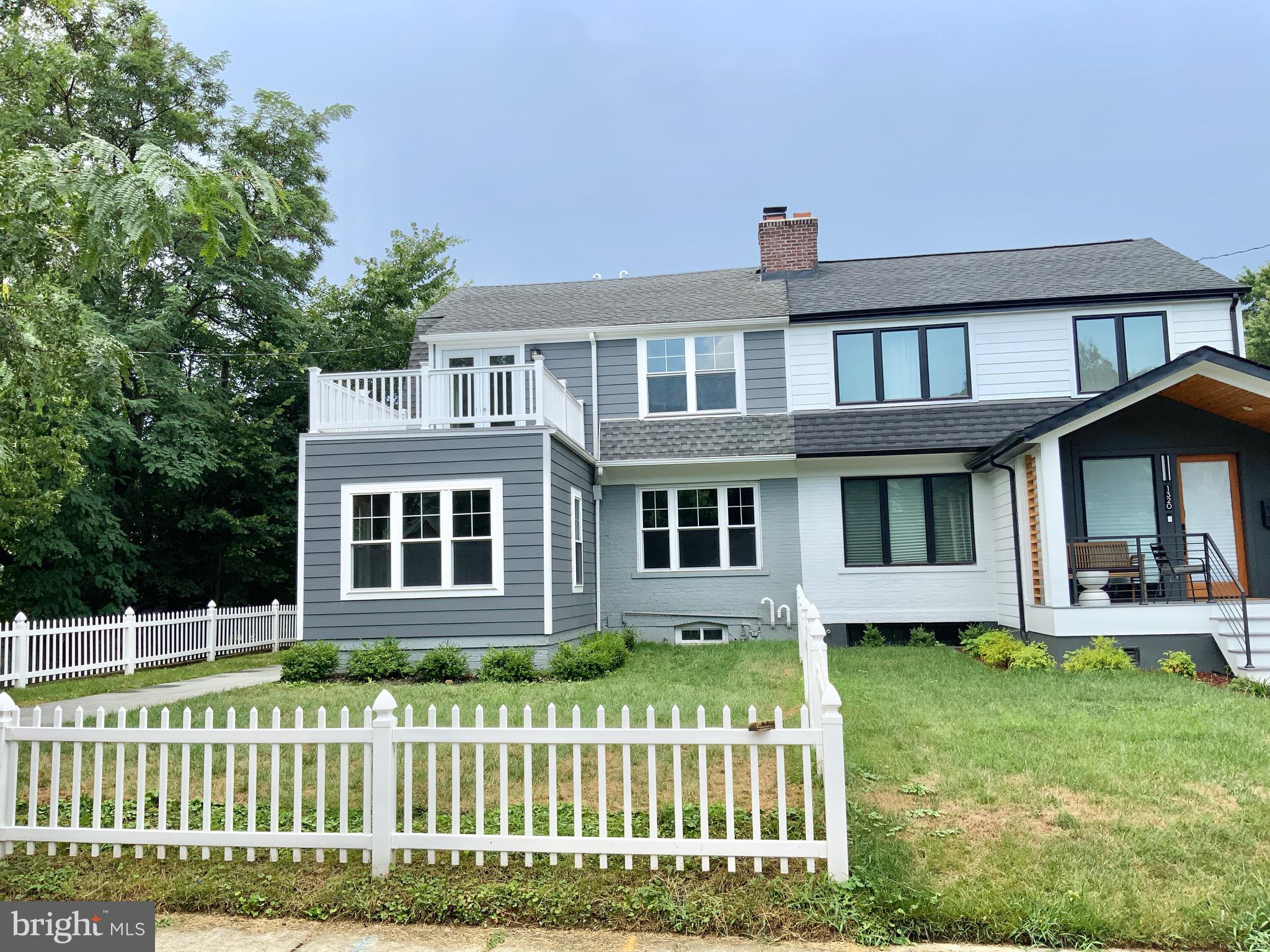 1318 Ingraham Street Northwest Washington, DC 20011 - Photo 1 of 35 front view of a house with a yard