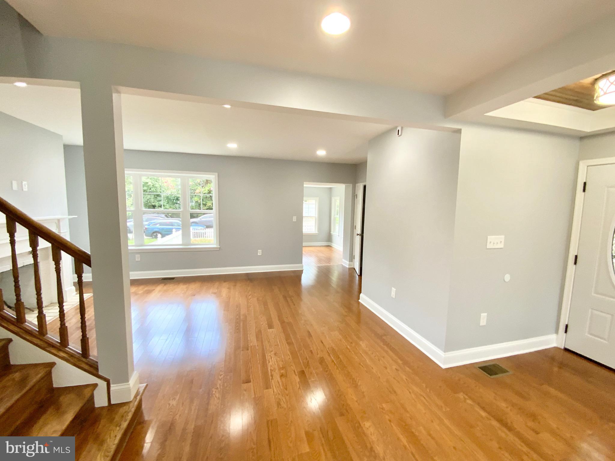 1318 Ingraham Street Northwest Washington, DC 20011 - Photo 11 of 35 an empty room with wooden floor and windows