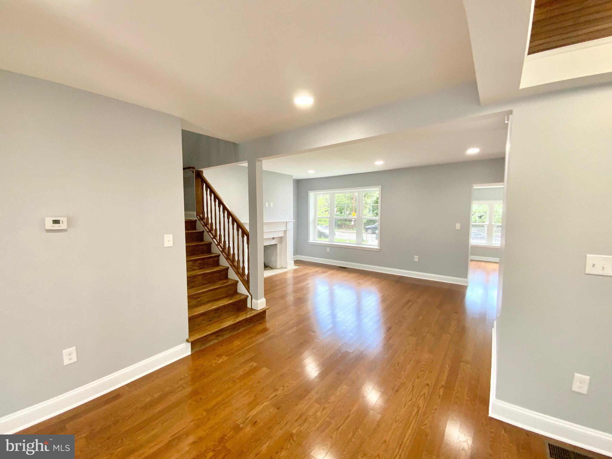 1318 Ingraham Street Northwest Washington, DC 20011 - Photo 12 of 35 a view of entryway with wooden floor and stairs