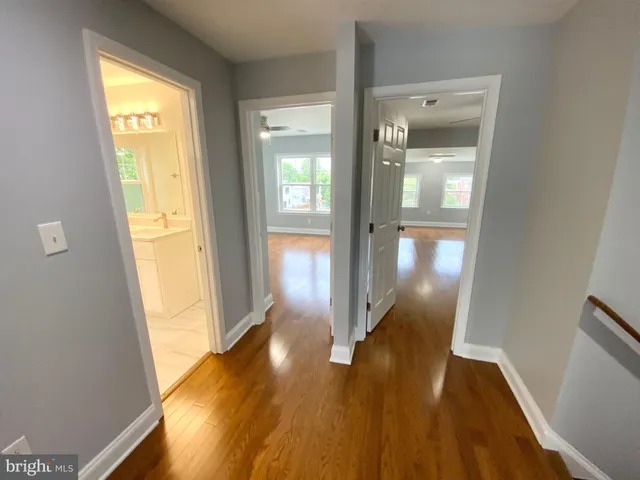 a view of gallery with wooden floor