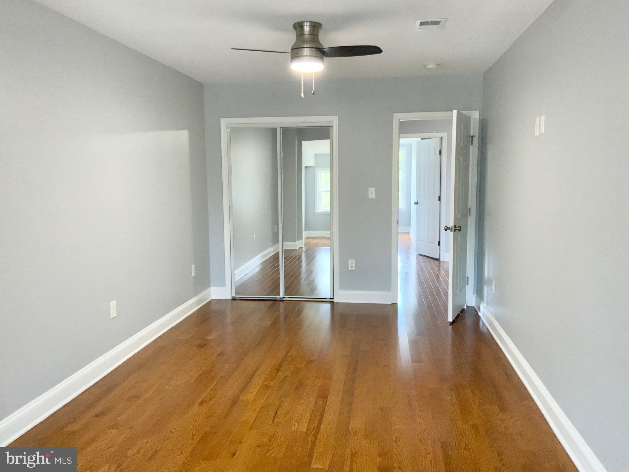 1318 Ingraham Street Northwest Washington, DC 20011 - Photo 27 of 35 wooden floor in an empty room