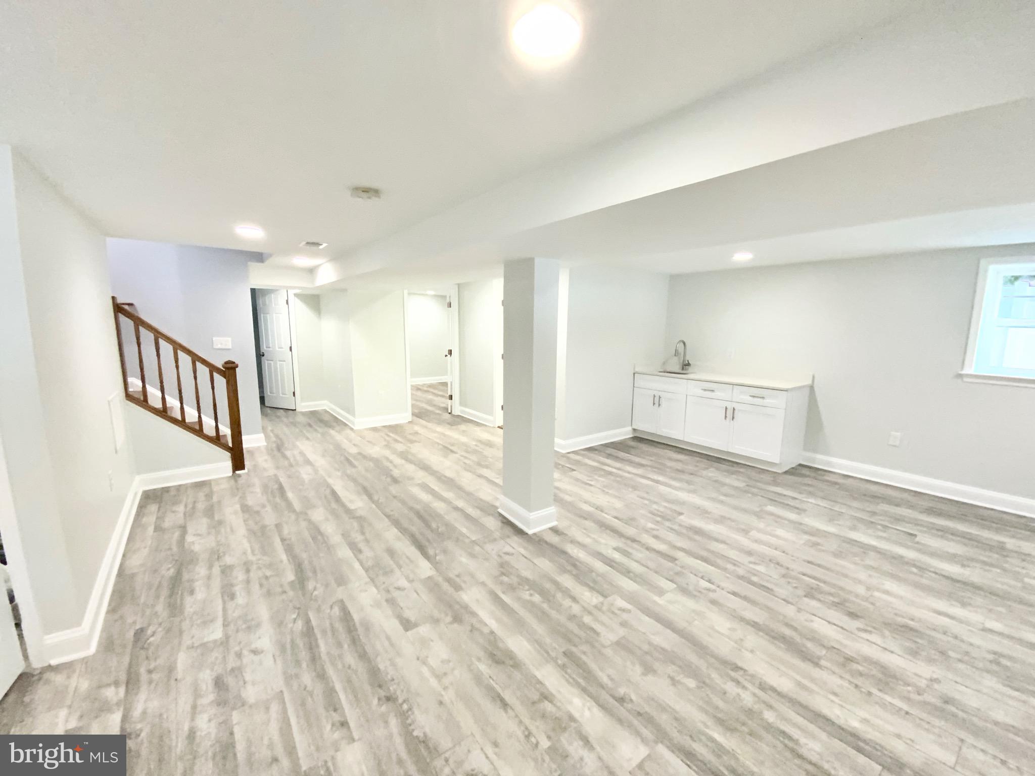 1318 Ingraham Street Northwest Washington, DC 20011 - Photo 29 of 35 a view of a big room with wooden floor and windows