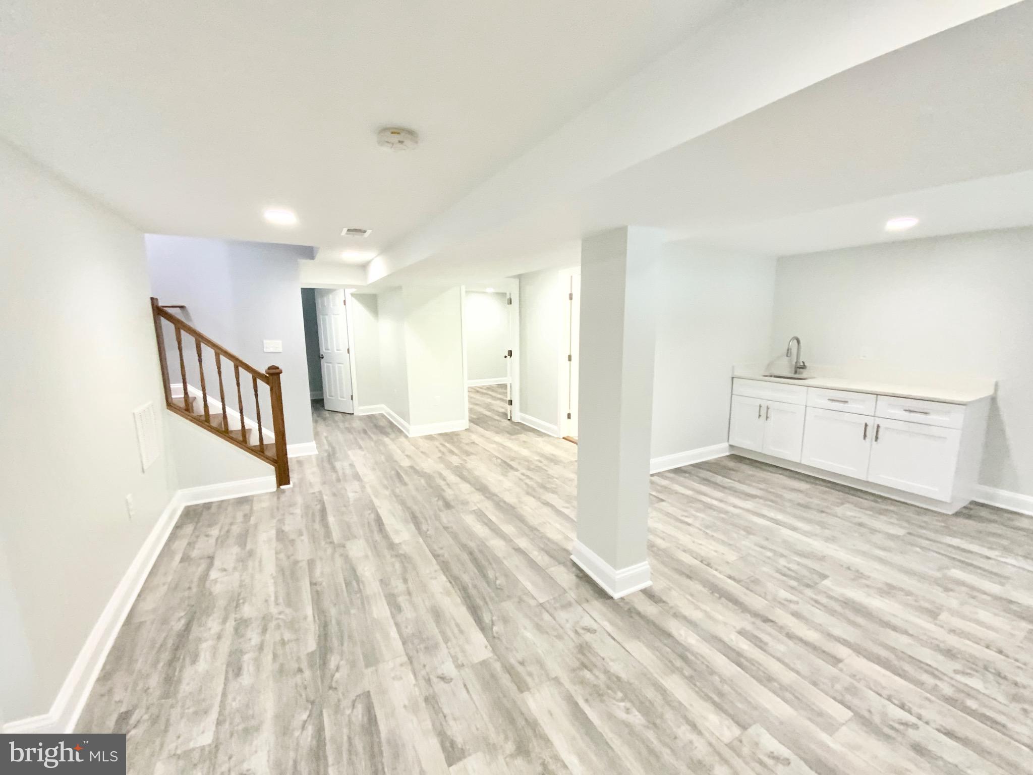 1318 Ingraham Street Northwest Washington, DC 20011 - Photo 30 of 35 a view of a big room with wooden floor and windows