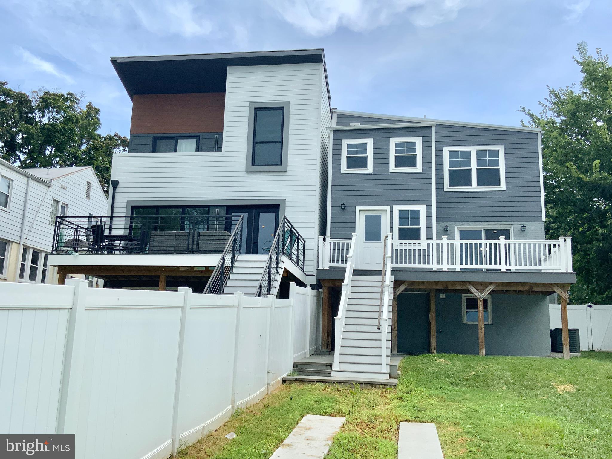 1318 Ingraham Street Northwest Washington, DC 20011 - Photo 35 of 35 a front view of a house with a yard