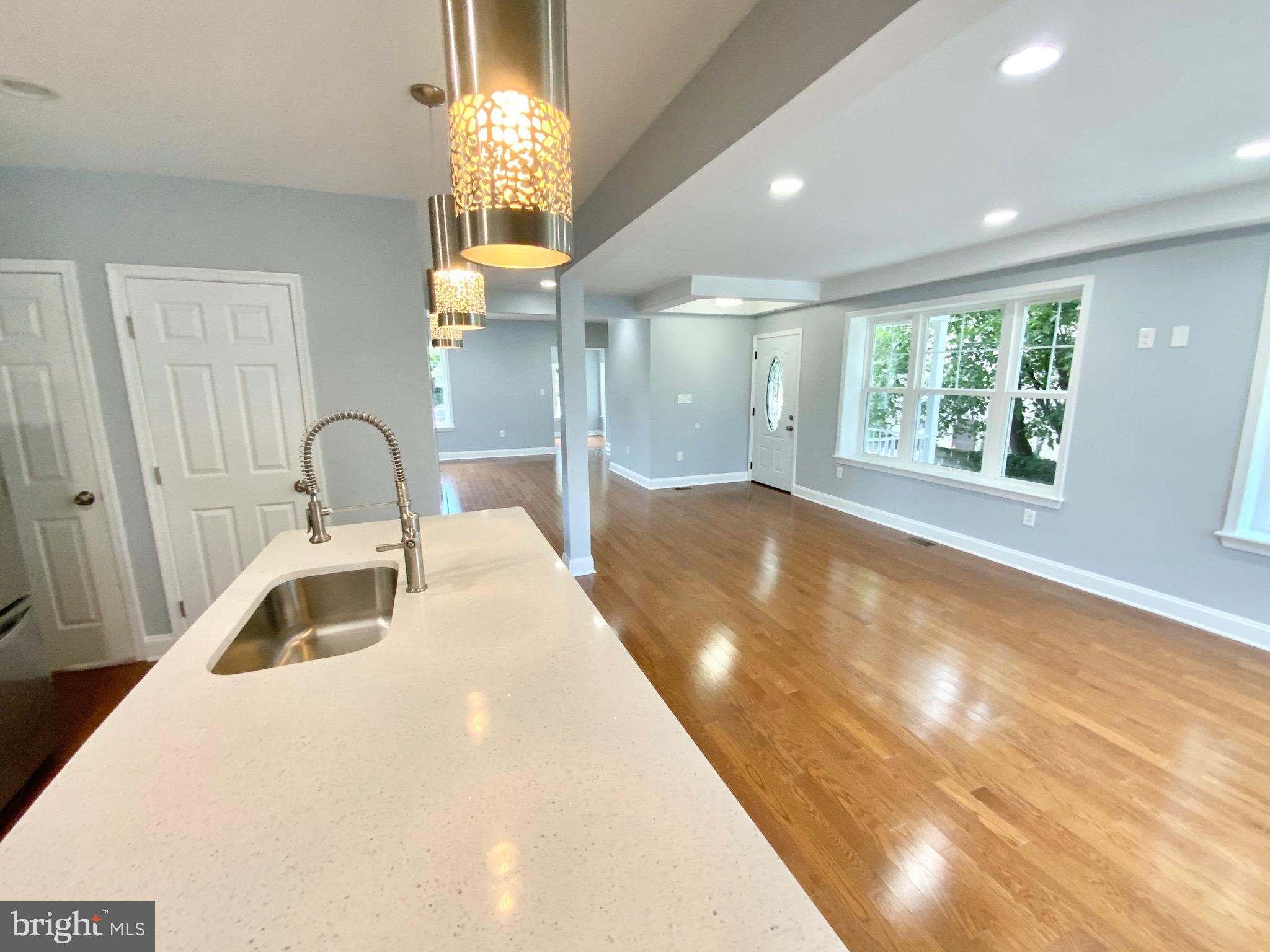 1318 Ingraham Street Northwest Washington, DC 20011 - Photo 7 of 35 a bathroom with a sink a large mirror and a bathtub
