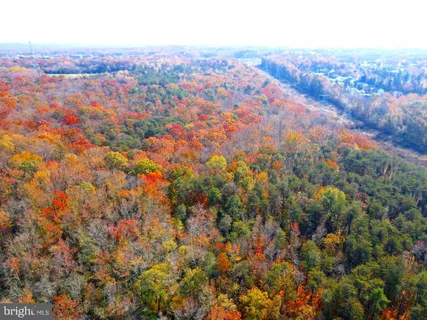 an aerial view of residential houses with city view