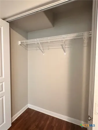 a view of a room with racks on the wall