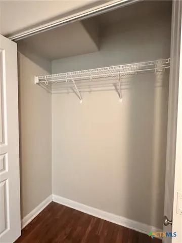 a view of a room with racks on the wall