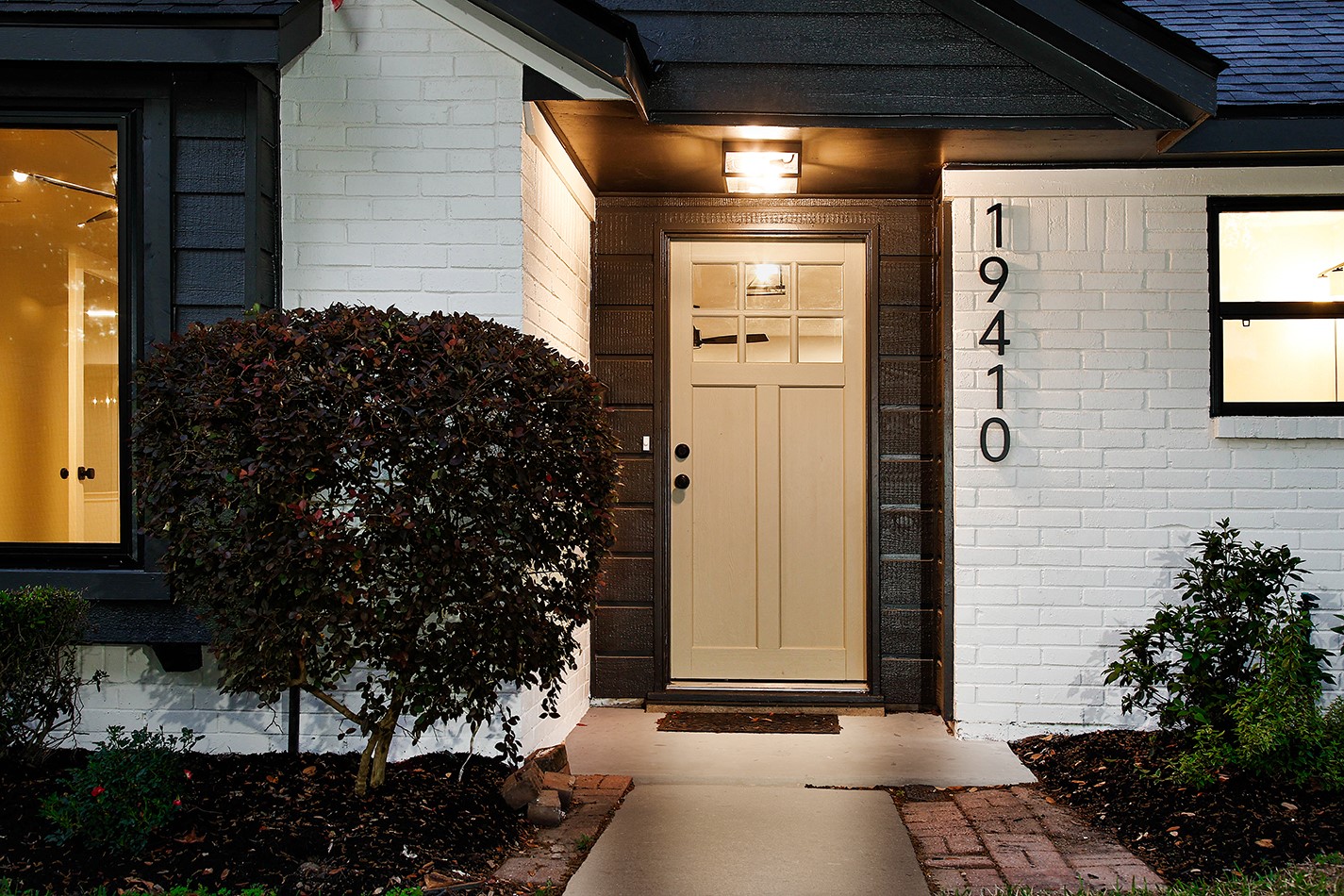 19410 Craigchester Lane Spring, TX 77388 - Photo 2 of 32 New paint in striking colors/tones, new windows in black (front), custom front door with modern floating address numbers, make this home the talk of the street and neighborhood.