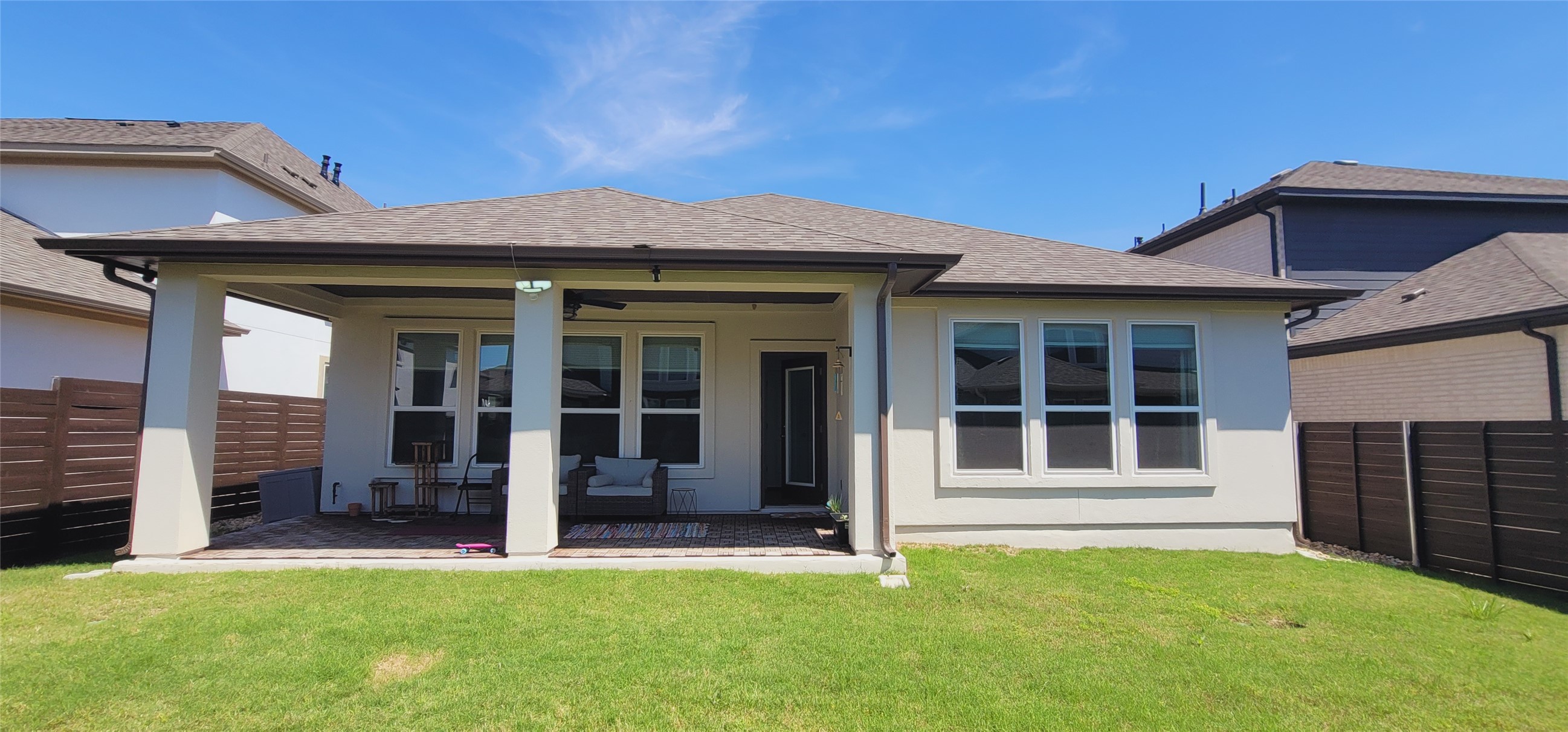 716 Leeward Pass Leander, TX 78641 - Photo 23 of 26 A spacious backyard provides ample room for outdoor activities, complementing the home's sheltered patio.