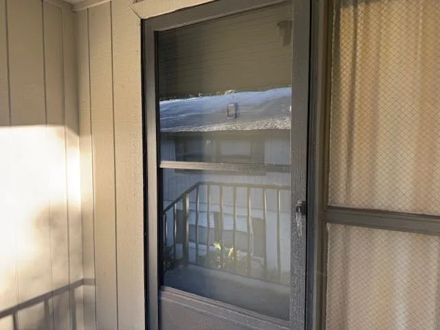 a bathroom with a glass shower door