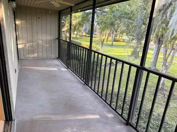a view of a glass door with a balcony