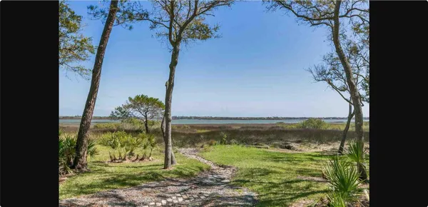 a view of a garden with a lake