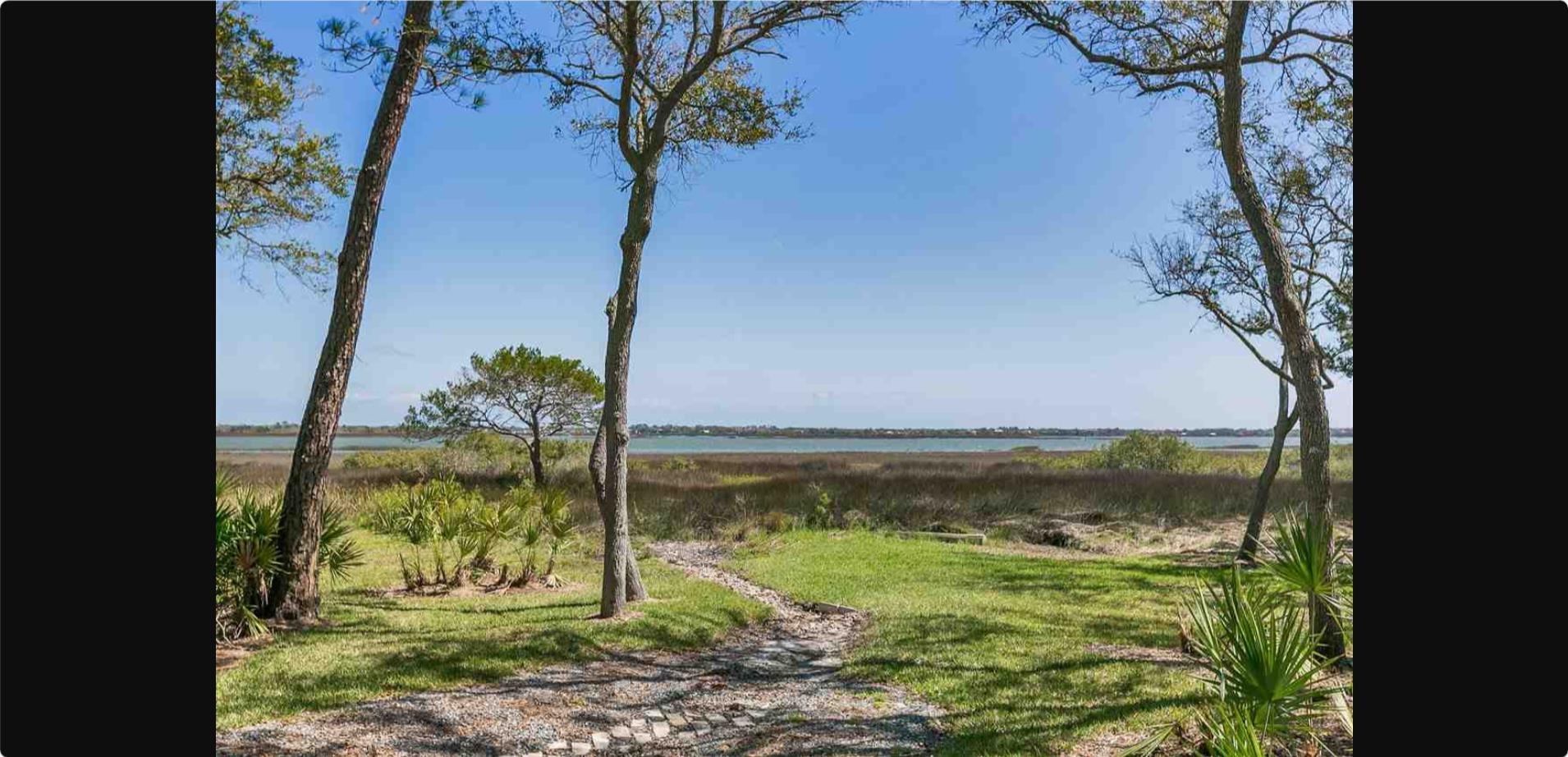 8 Alcira Court St. Augustine, FL 32086 - Photo 7 of 13 a view of a garden with a lake