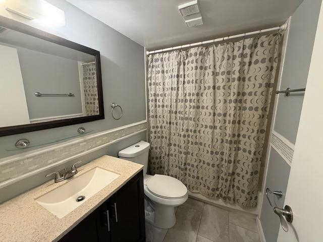 8 Alcira Court St. Augustine, FL 32086 - Photo 8 of 13 a bathroom with a sink a toilet and shower curtain