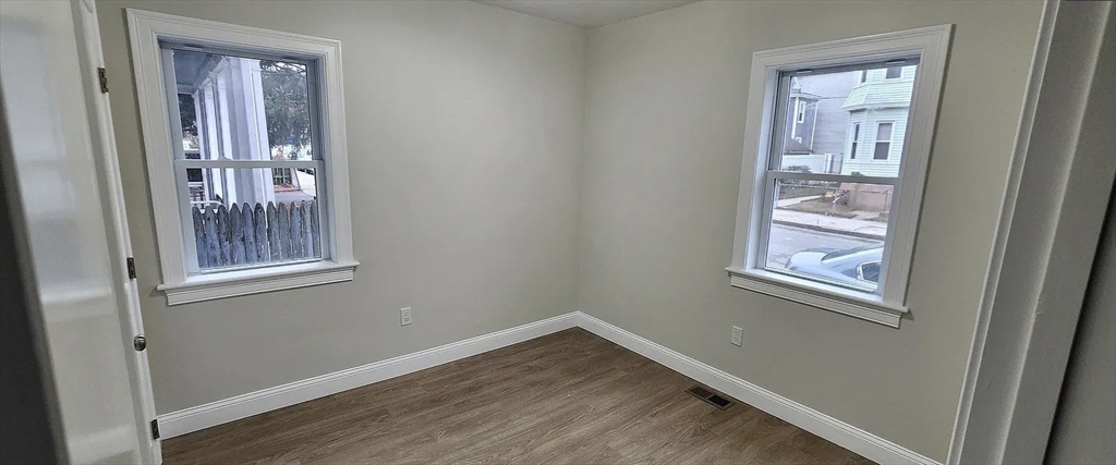 322 Brownell Street, Unit 1E Fall River, MA 02720 - Photo 4 of 6 an empty room with windows