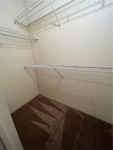 a view of a room with racks on the wall