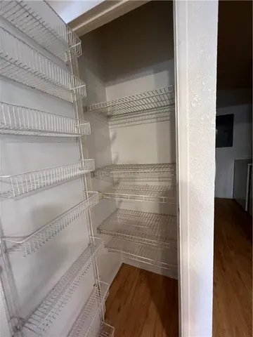 a bathroom with a glass shower door