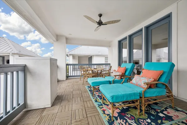 a view of a patio with couches and potted plants